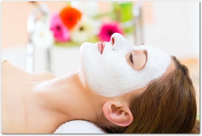 Wellness - woman getting face mask in spa