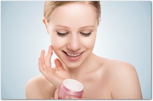 skin care.  beauty  girl with eyes closed with jar of cream